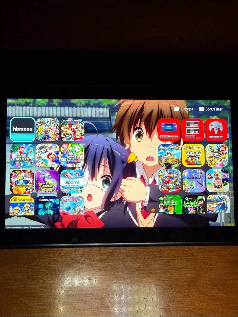 Nintendo Switch with Clear Shell and Pink Screen Artwork